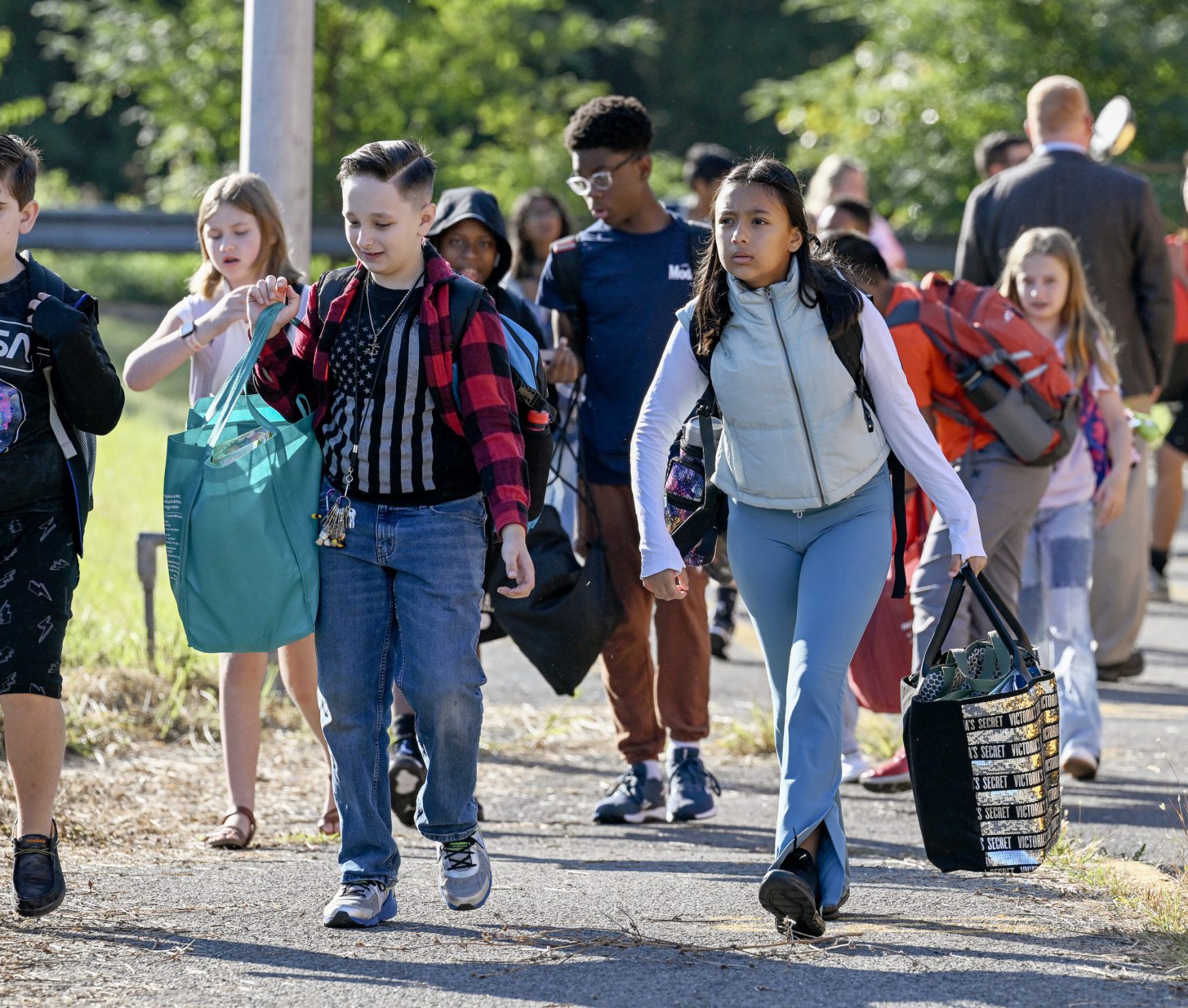 Students walking into the middle school on the first day of school.