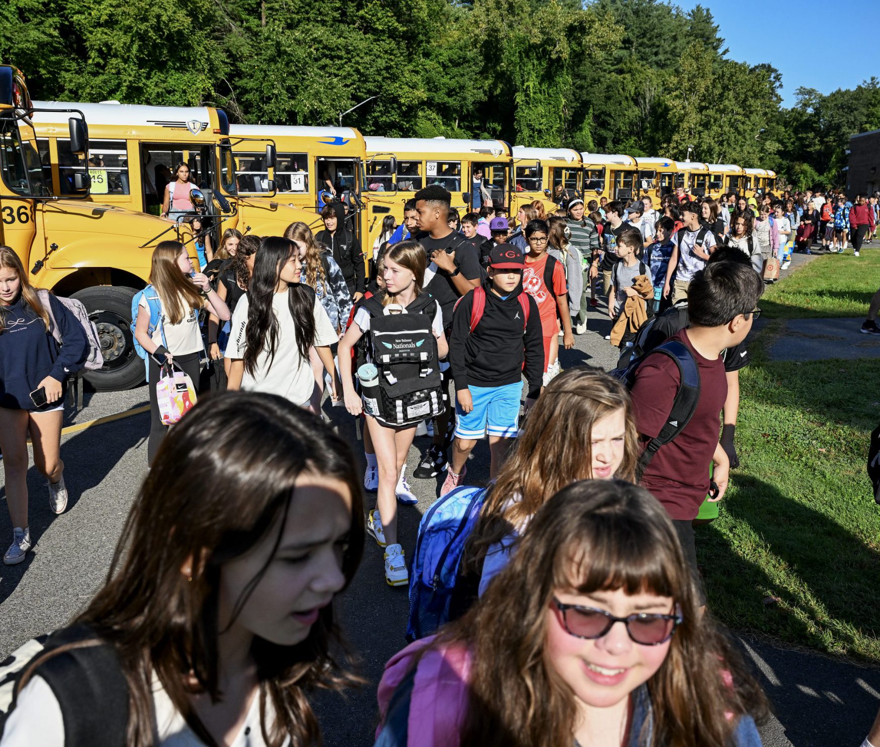 Students walking into the middle school on the first day of school.