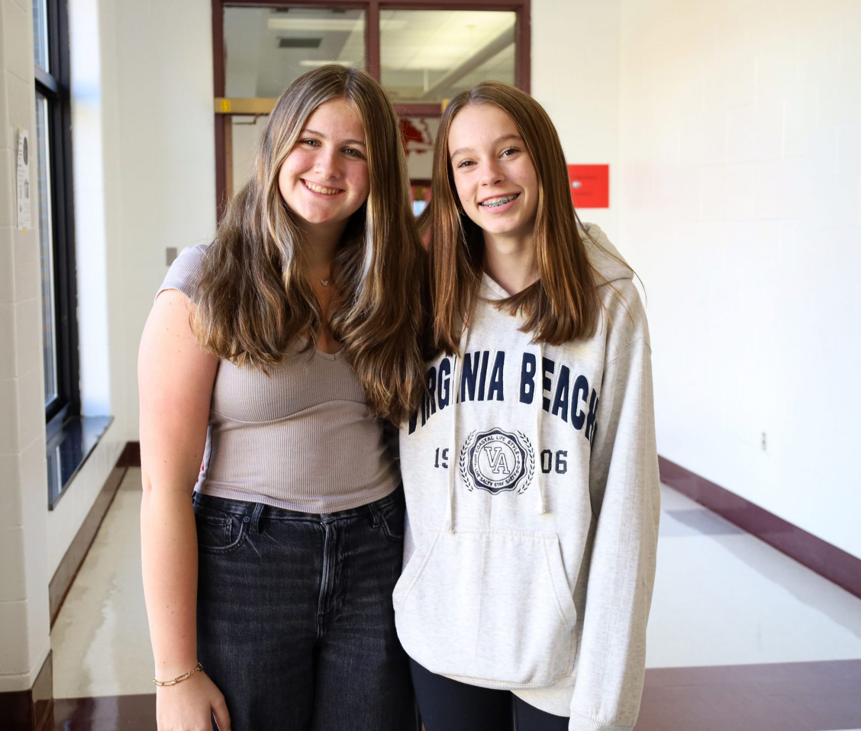 Two students posing and smiling for a photo.