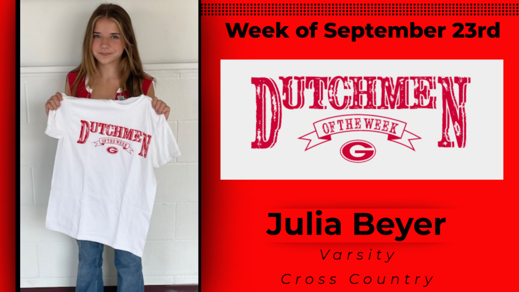 Student holding up Dutchmen of the Week tshirt.