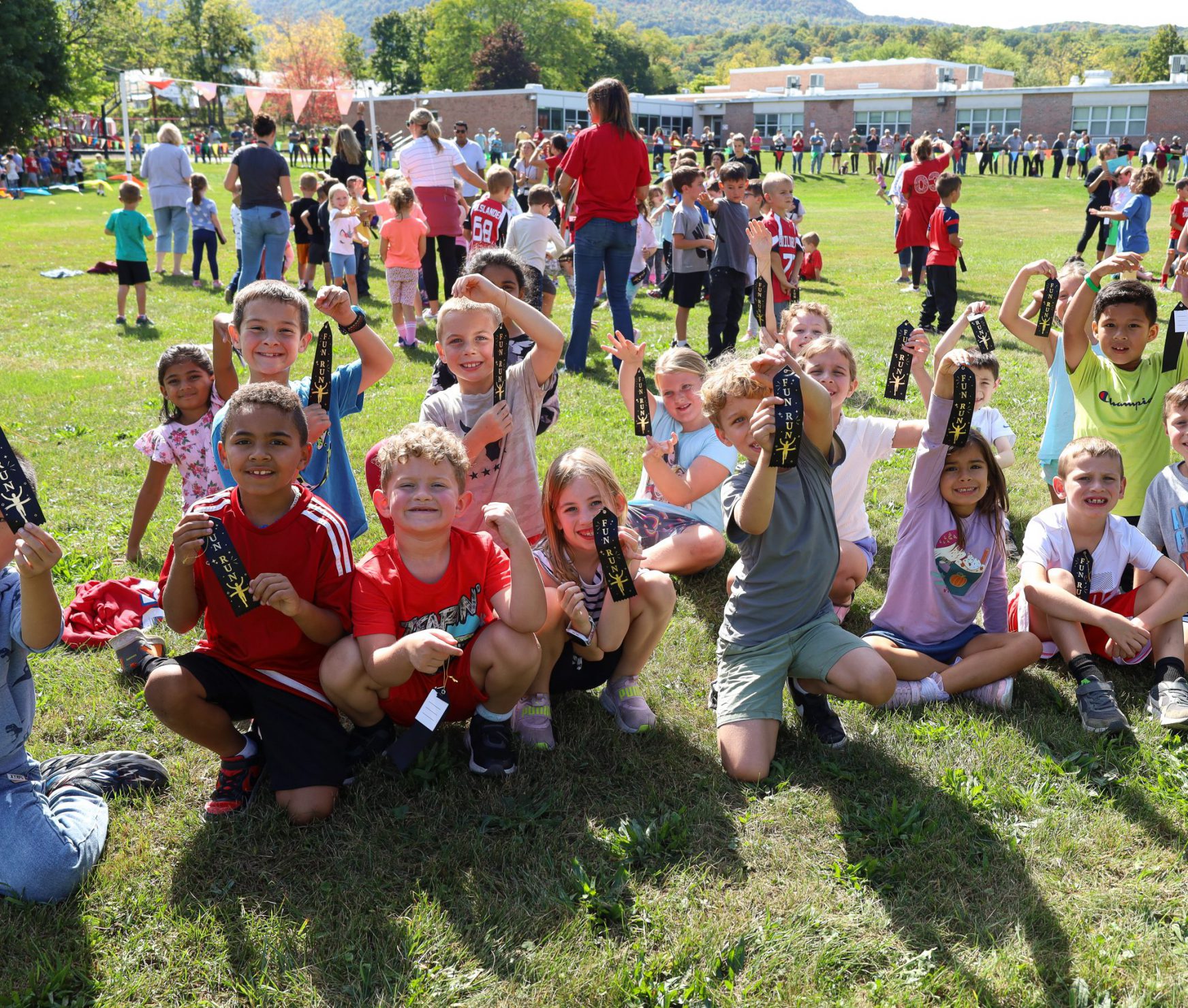 Students holding Fun Run awards.