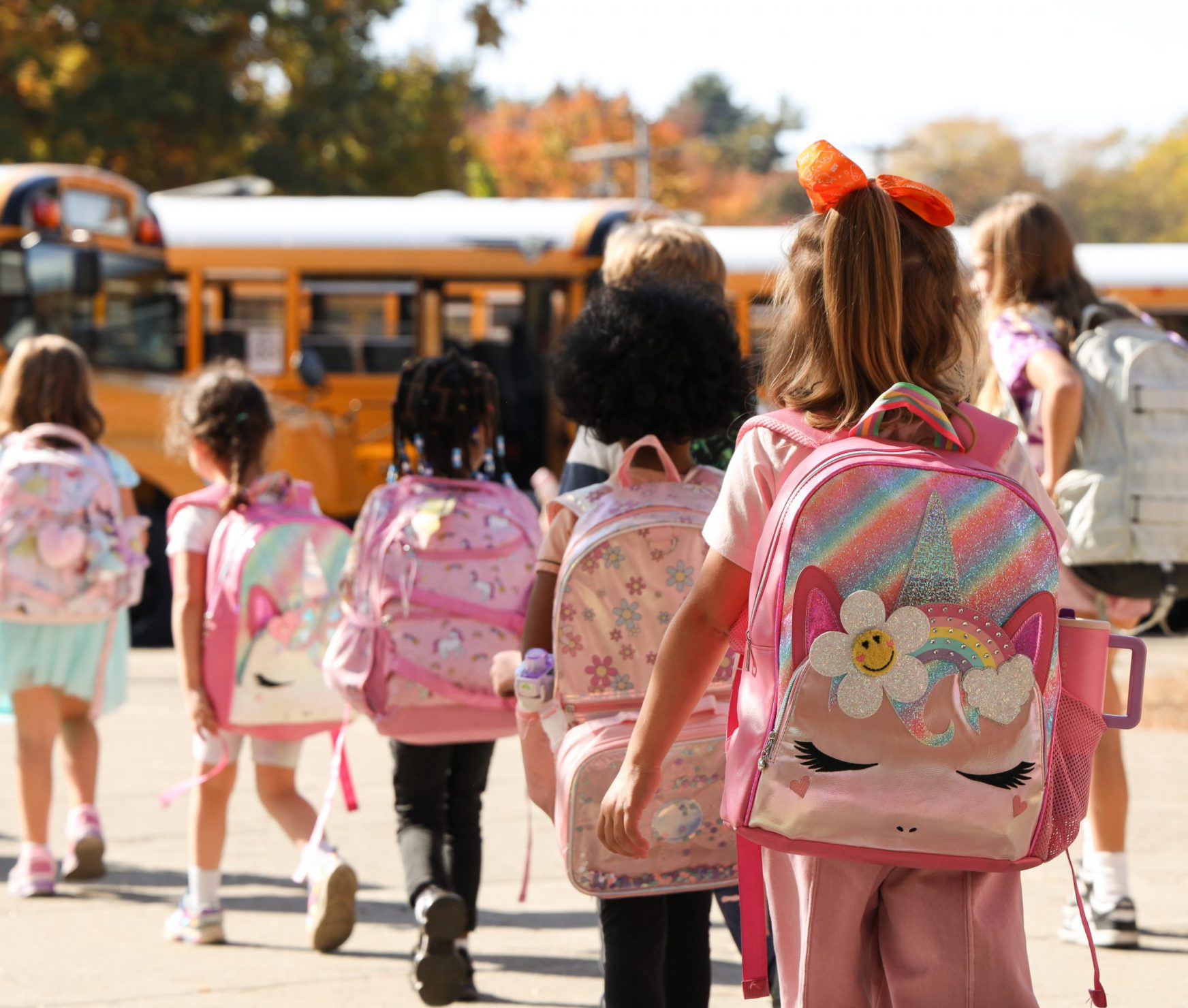 Students walking to the bus at the end of the day.