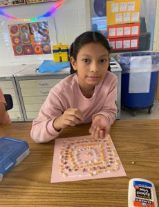 Elementary student working on an art project.