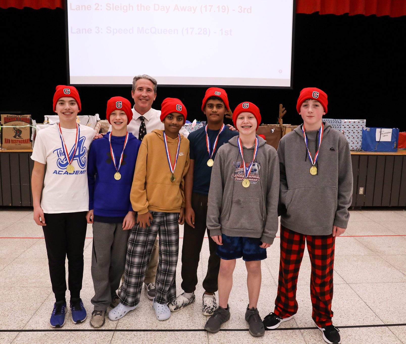 Students lining up at FMS after winning the annual sled races.