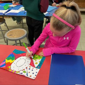 Elementary student working on an art project.