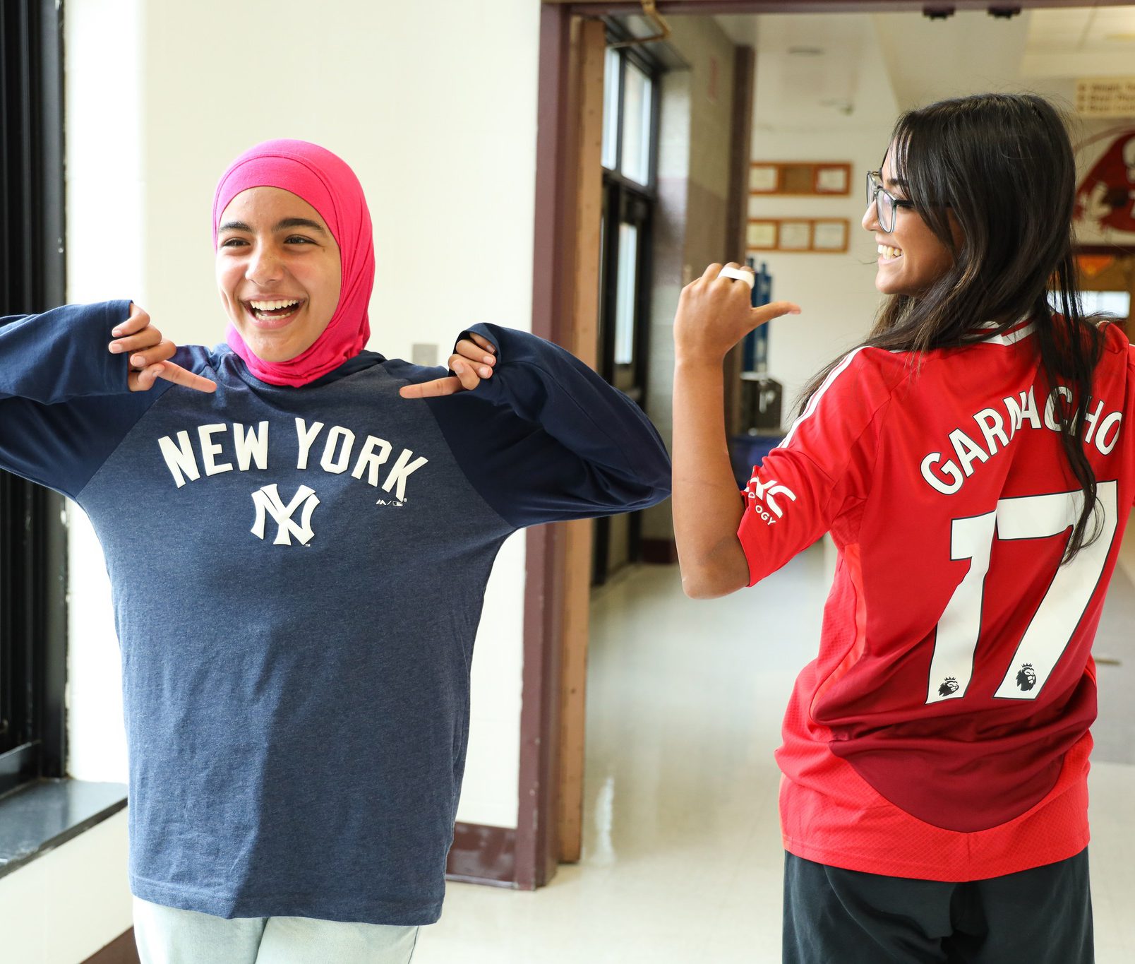 Two GHS students havign fun during spirit week and showing their favorite teams.