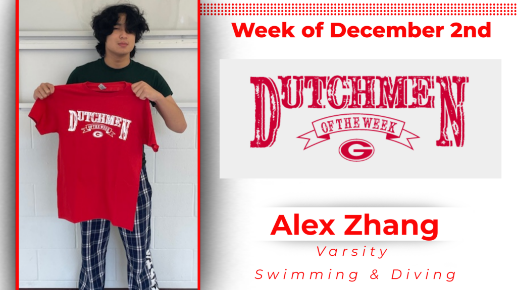 Student smiling holding up a tshirt for Dutchmen of the Week. 