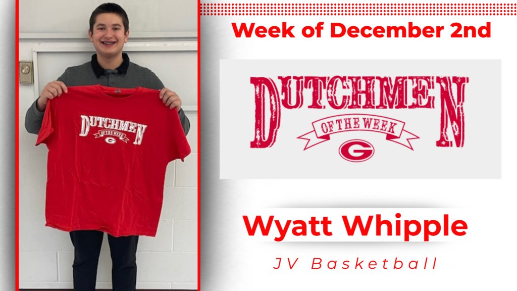 Student smiling holding up a tshirt for Dutchmen of the Week.