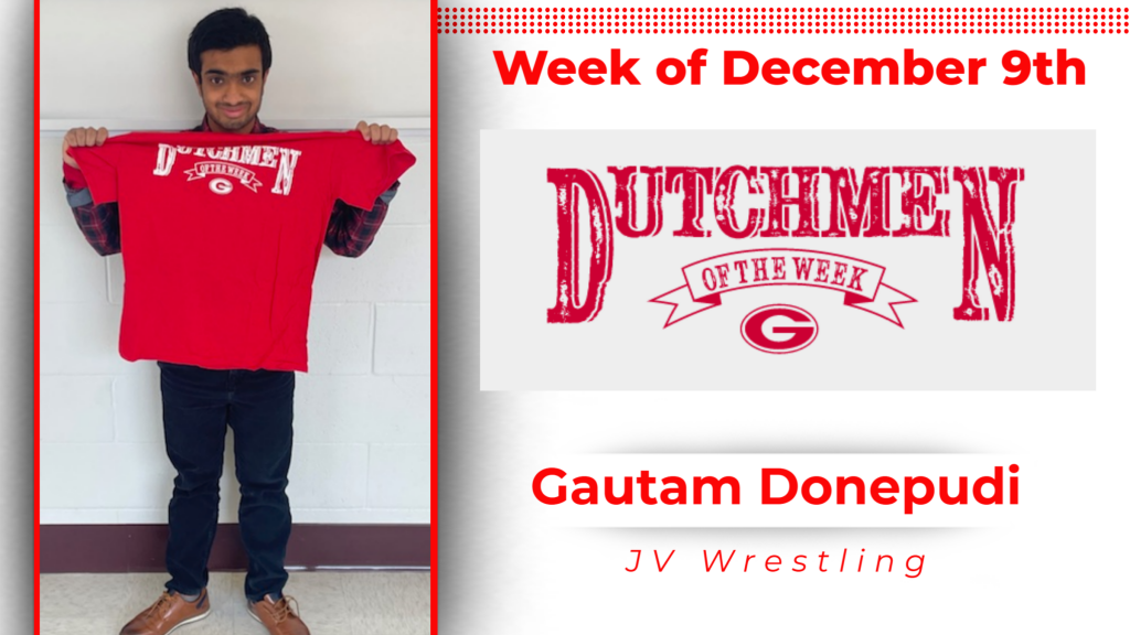 student smiling and holding up Dutchmen of the Week shirt.