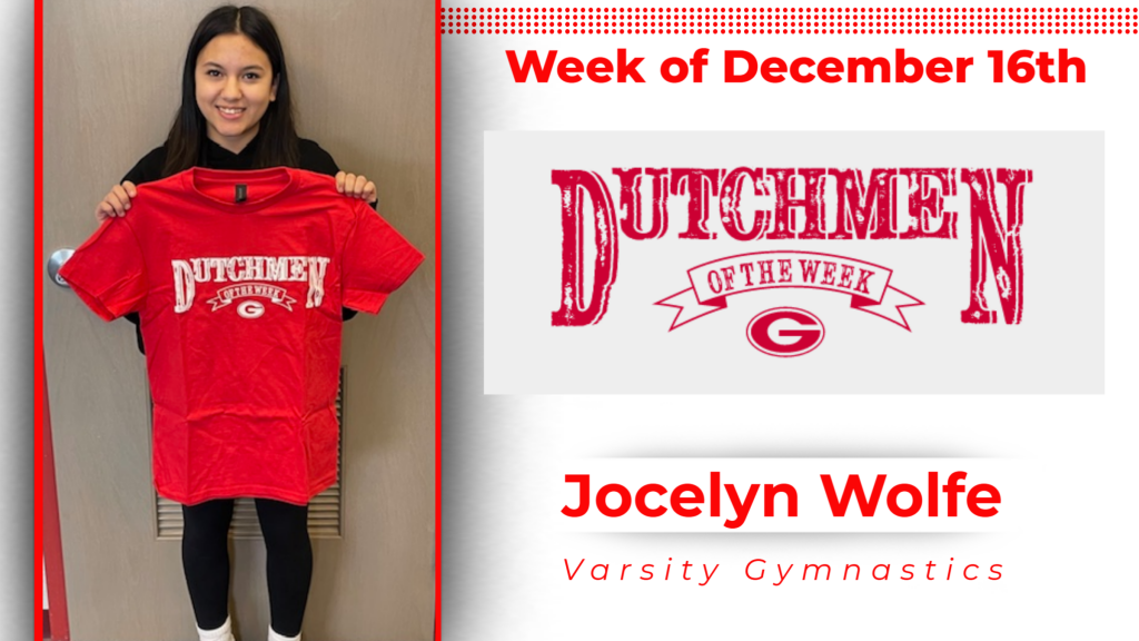 student smiling and holding up Dutchmen of the Week tshirt. 