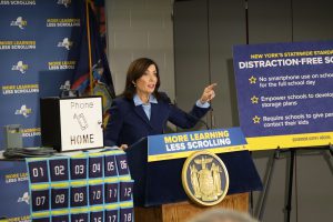 Gov. Hochul speaks at a podium, gesturing