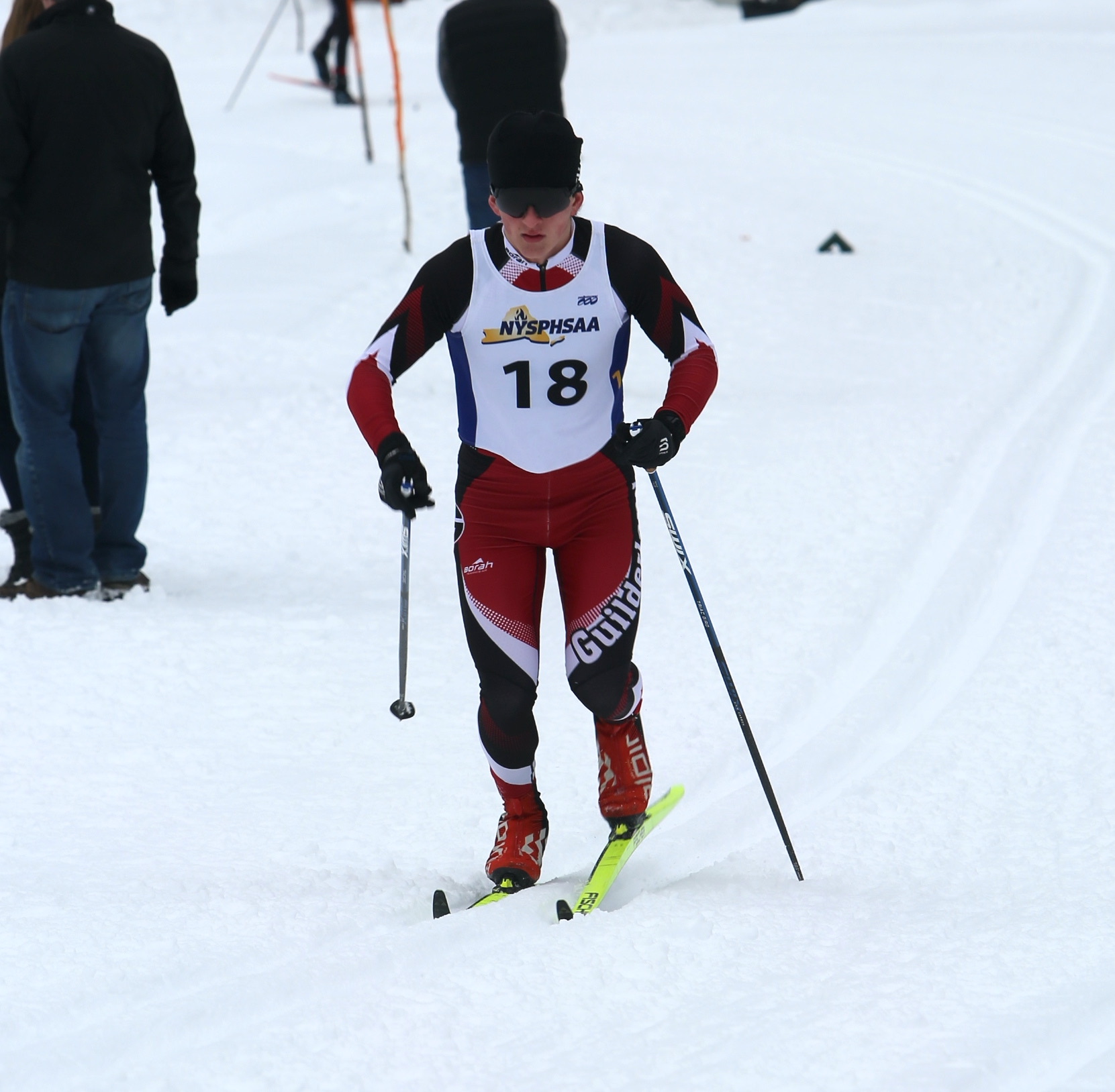 A student cross country skiis